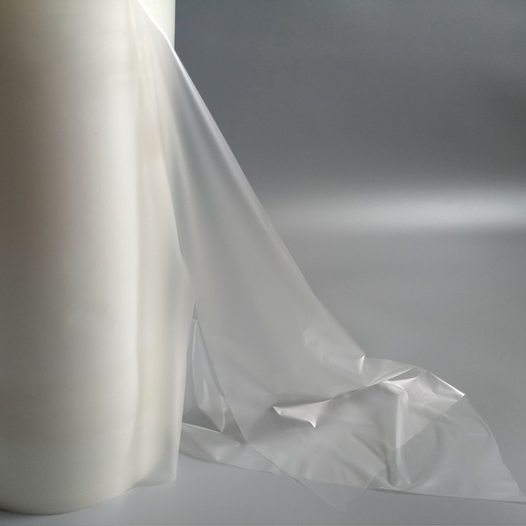 Microscopic cross-section of PES hot melt adhesive film bonding to OEM textile substrate