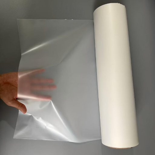 Engineer inspecting the physical properties and clarity of industrial hot melt adhesive film on a production roll